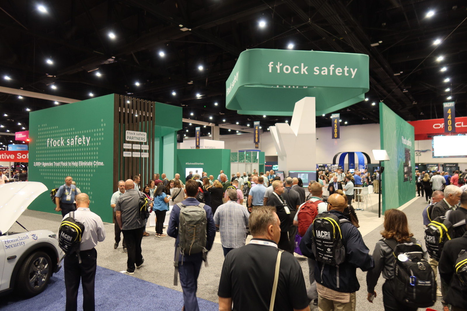 A crowd around the Flock Safety set-up at a police conference.